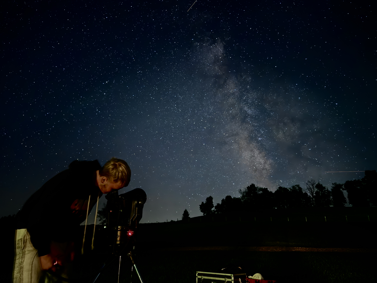 Kieghan at the telescope beneath the Milky Way