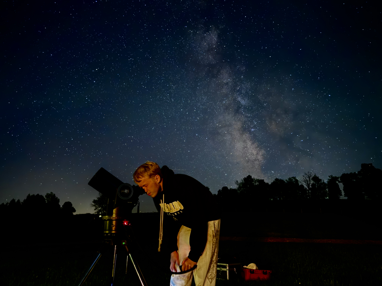 Setting up the telescope under a star-filled sky
